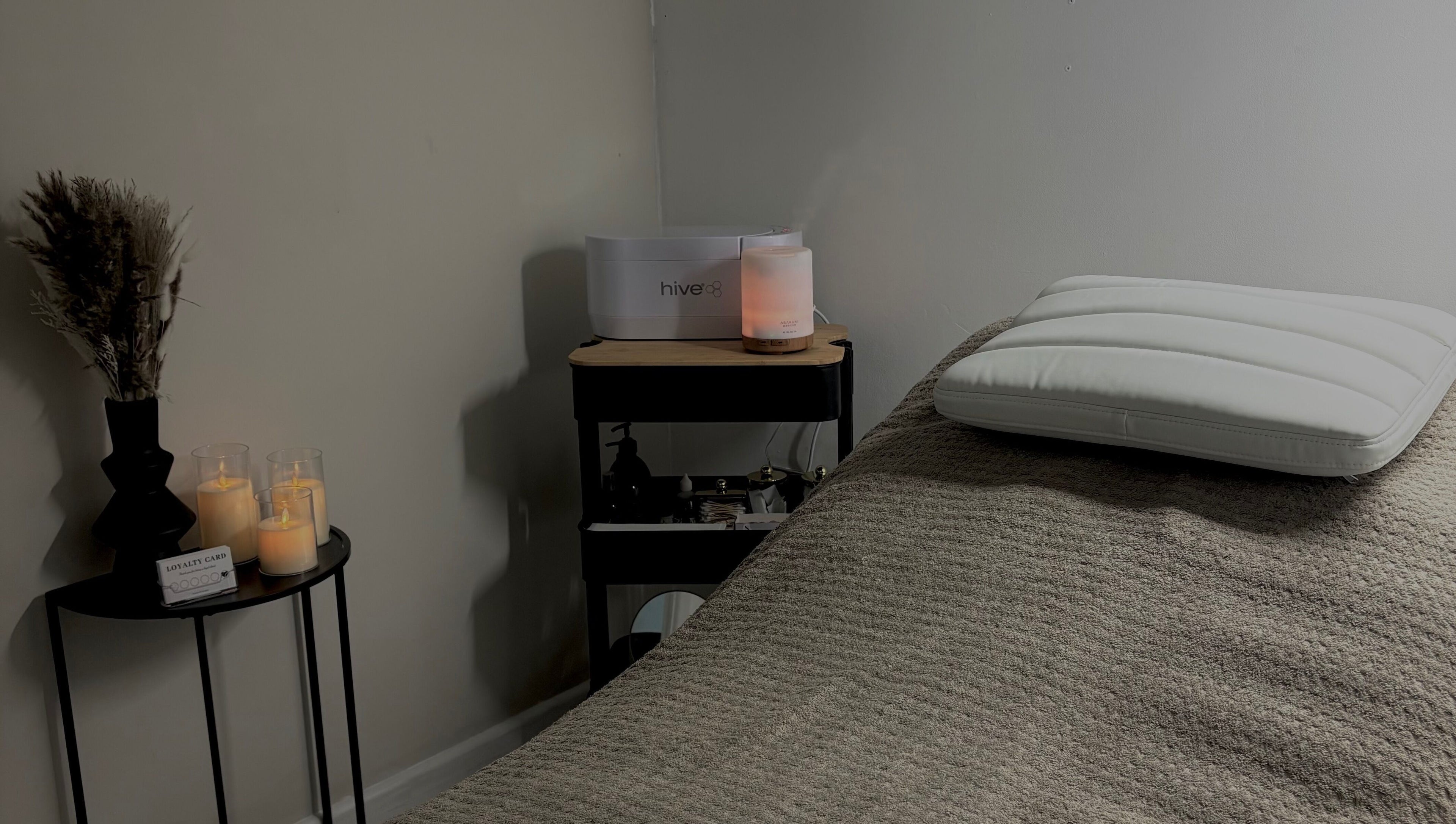 Relaxing spa setup with candles and diffuser at Beauty by Imogen in Portsmouth, England, GB.