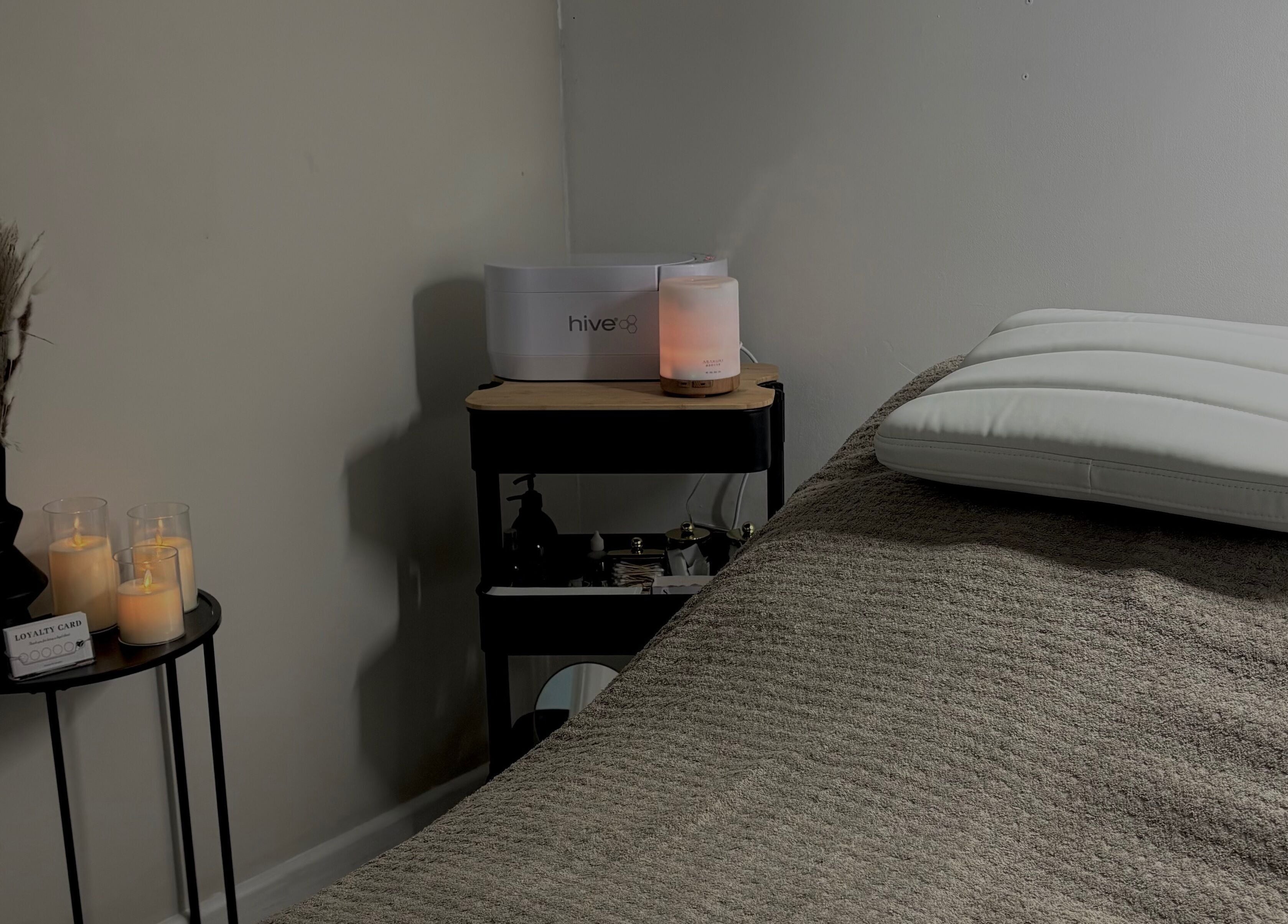 Relaxing spa setup with candles and diffuser at Beauty by Imogen in Portsmouth, England, GB.