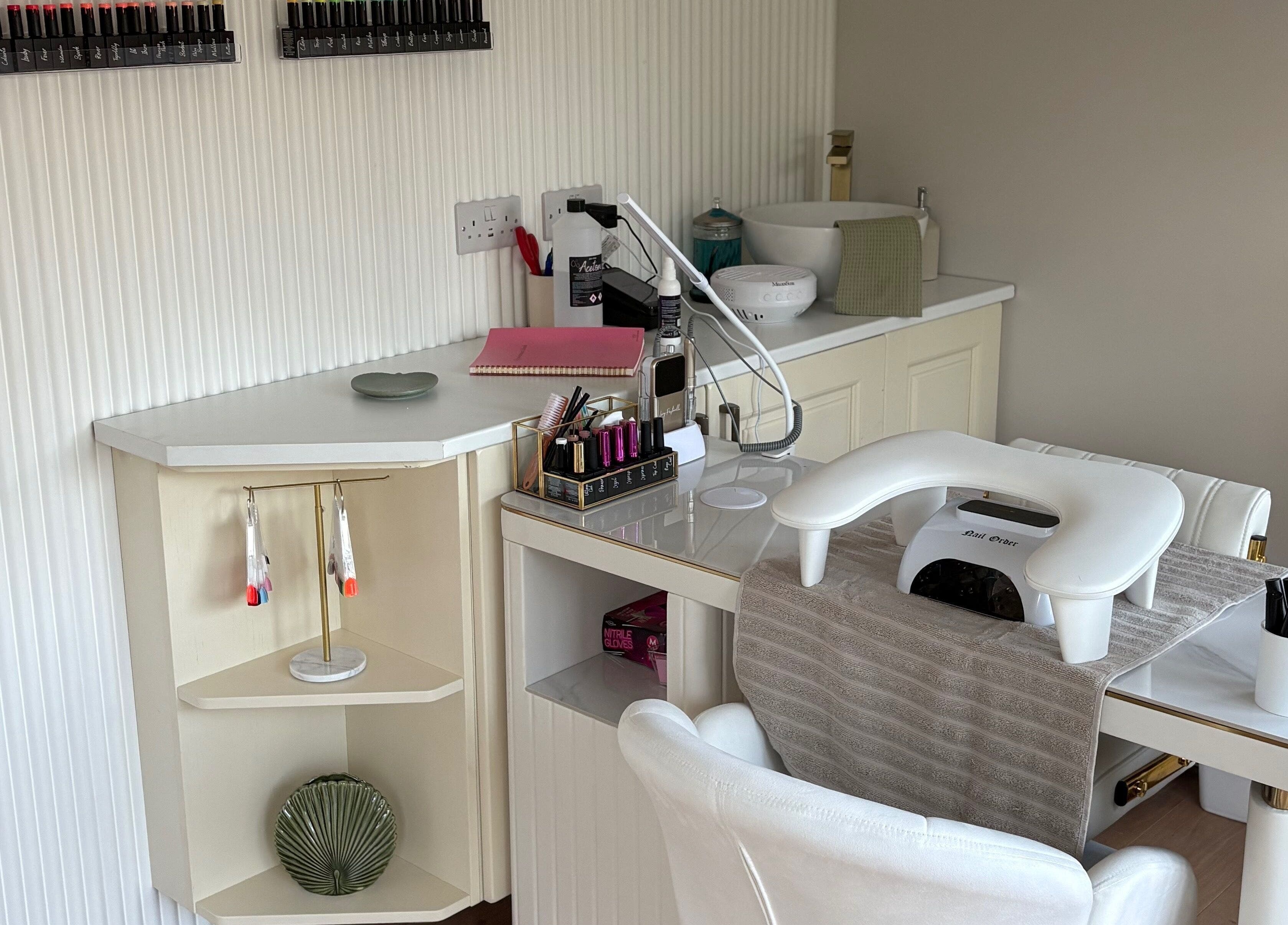 Elegant nail station at The Forge Beauty Room, Newsham, England, GB, showcasing tools and polish selection.