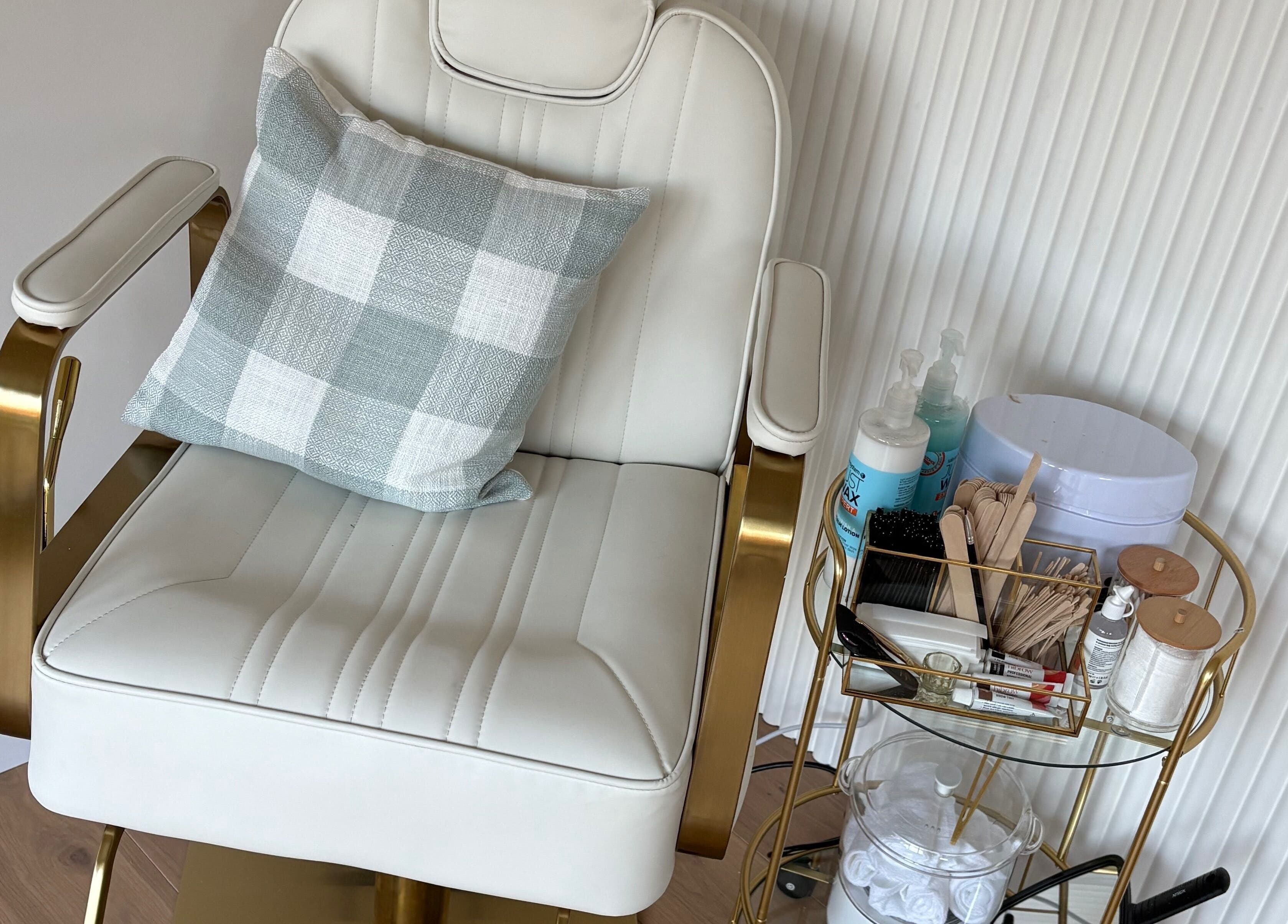Luxurious beauty chair at The Forge Beauty Room, Newsham, England, GB, surrounded by treatment essentials.