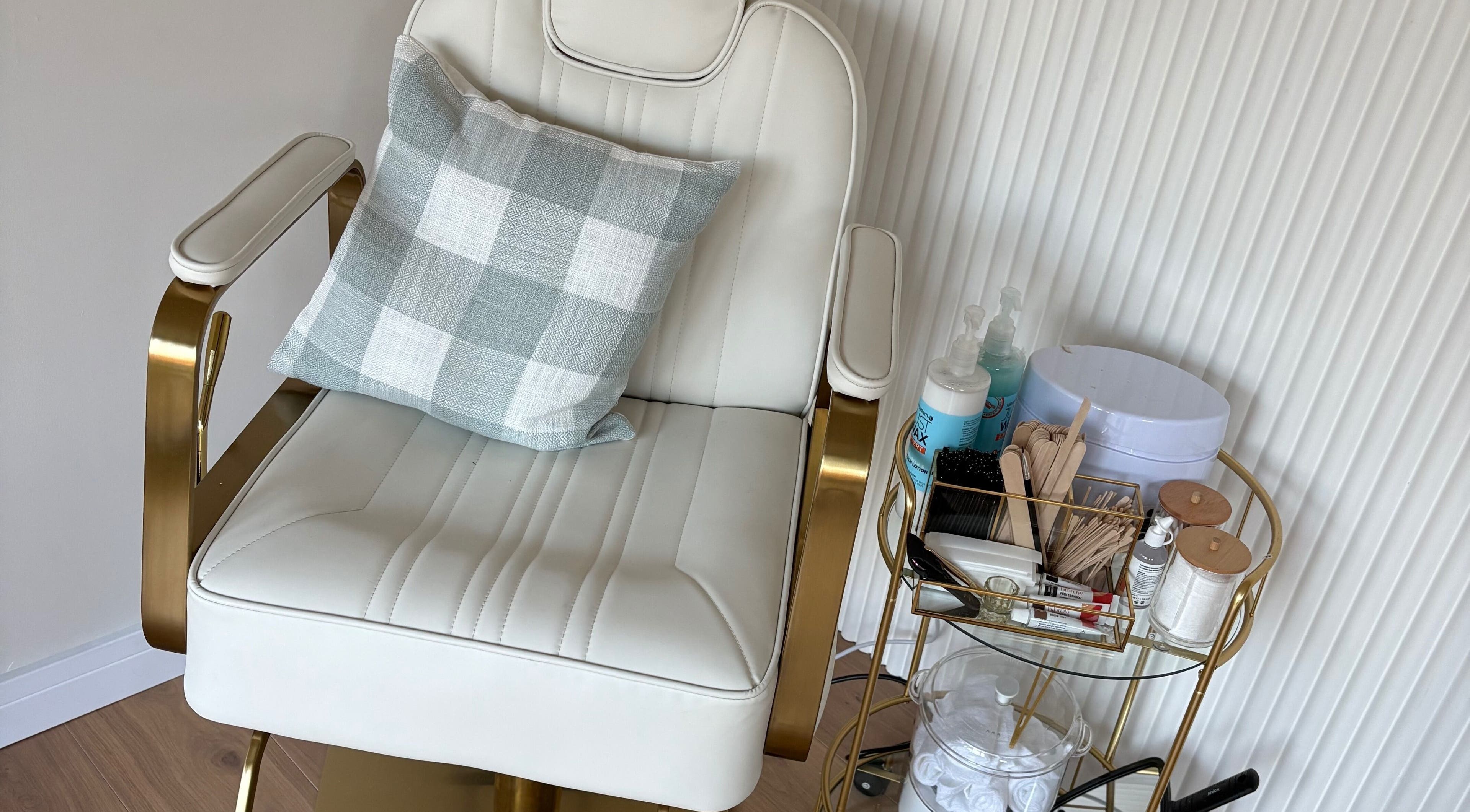 Luxurious beauty chair at The Forge Beauty Room, Newsham, England, GB, surrounded by treatment essentials.