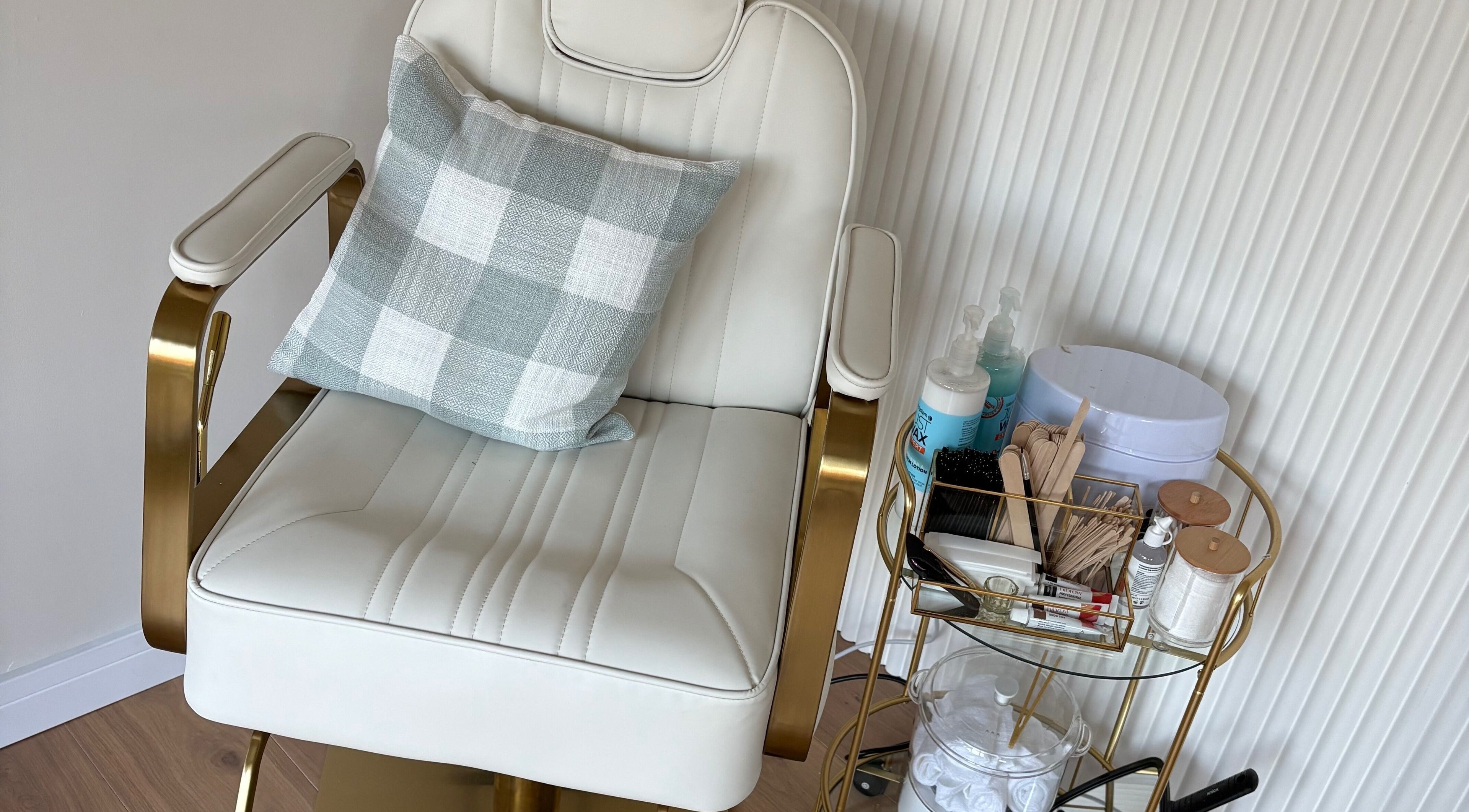 Luxurious beauty chair at The Forge Beauty Room, Newsham, England, GB, surrounded by treatment essentials.