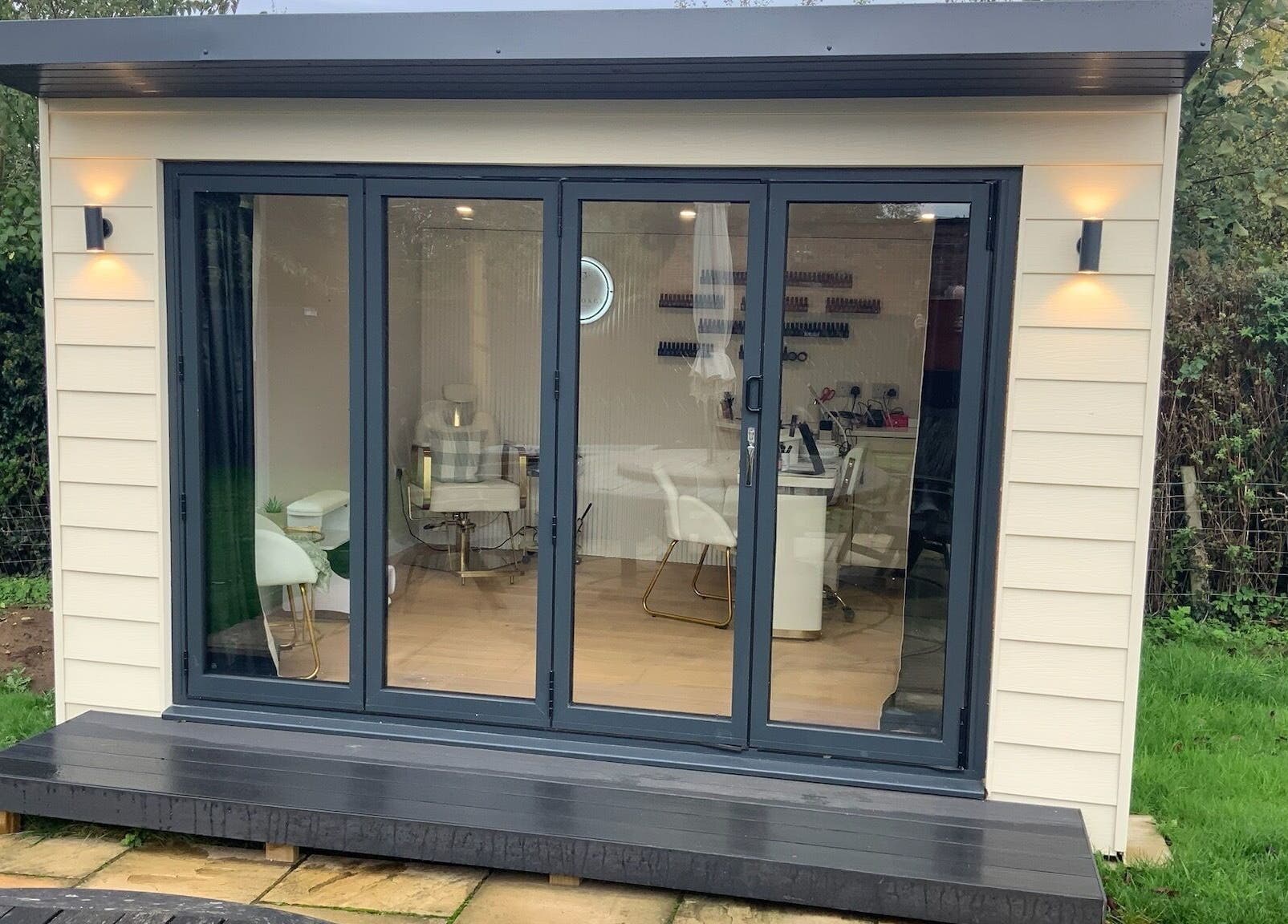 The Forge Beauty Room in Newsham, England showcases a modern, inviting exterior with large glass doors.