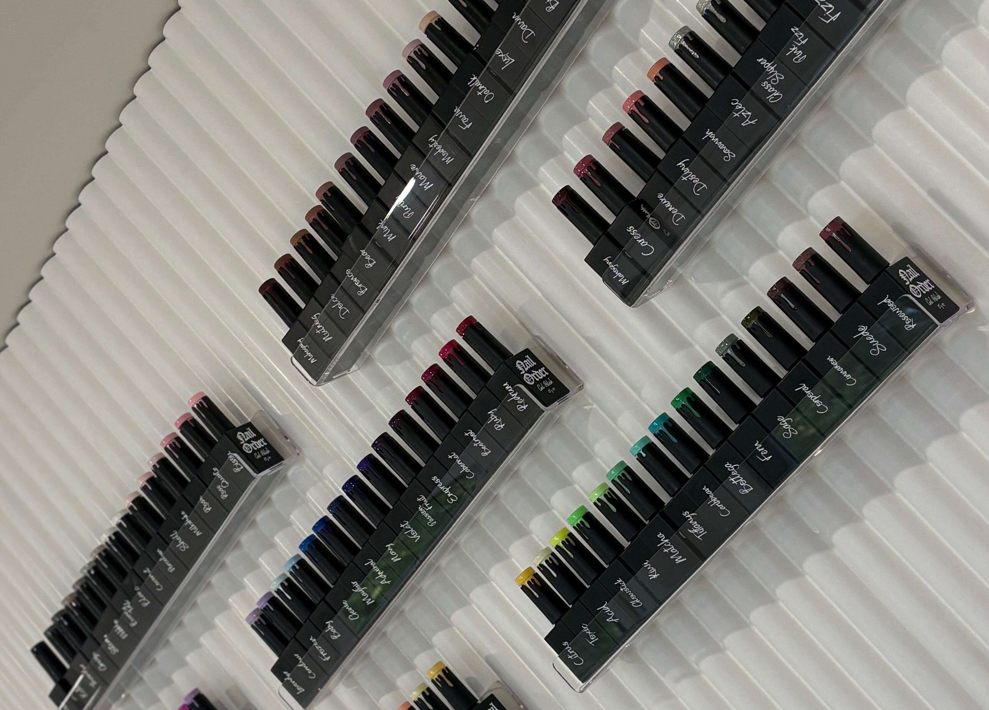 Colorful nail polish palette at The Forge Beauty Room in Newsham, England, GB, enhancing the elegant decor.