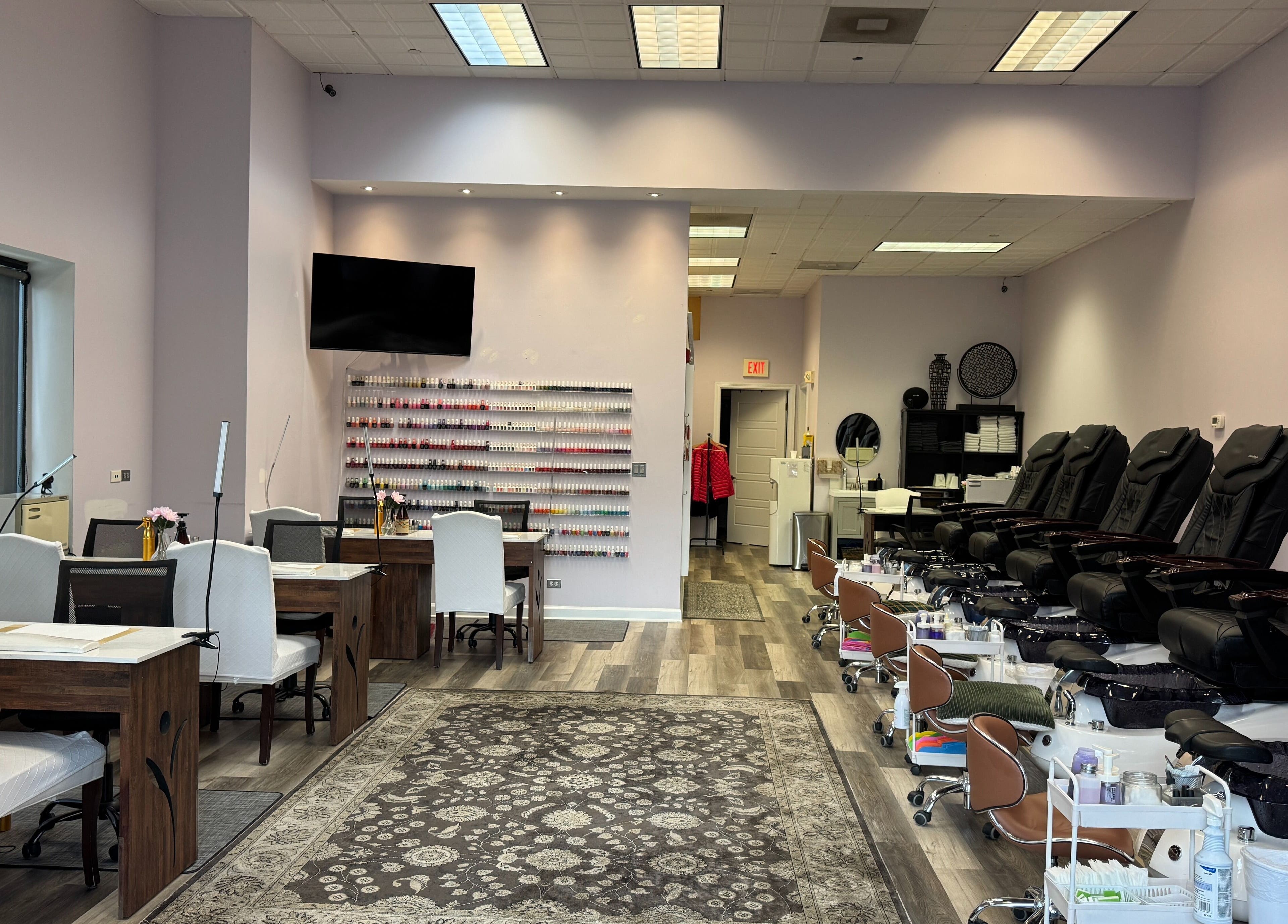 Elegant interior of Misheel Nail Spa in Vernon Hills, Illinois, US with modern manicure and pedicure stations.