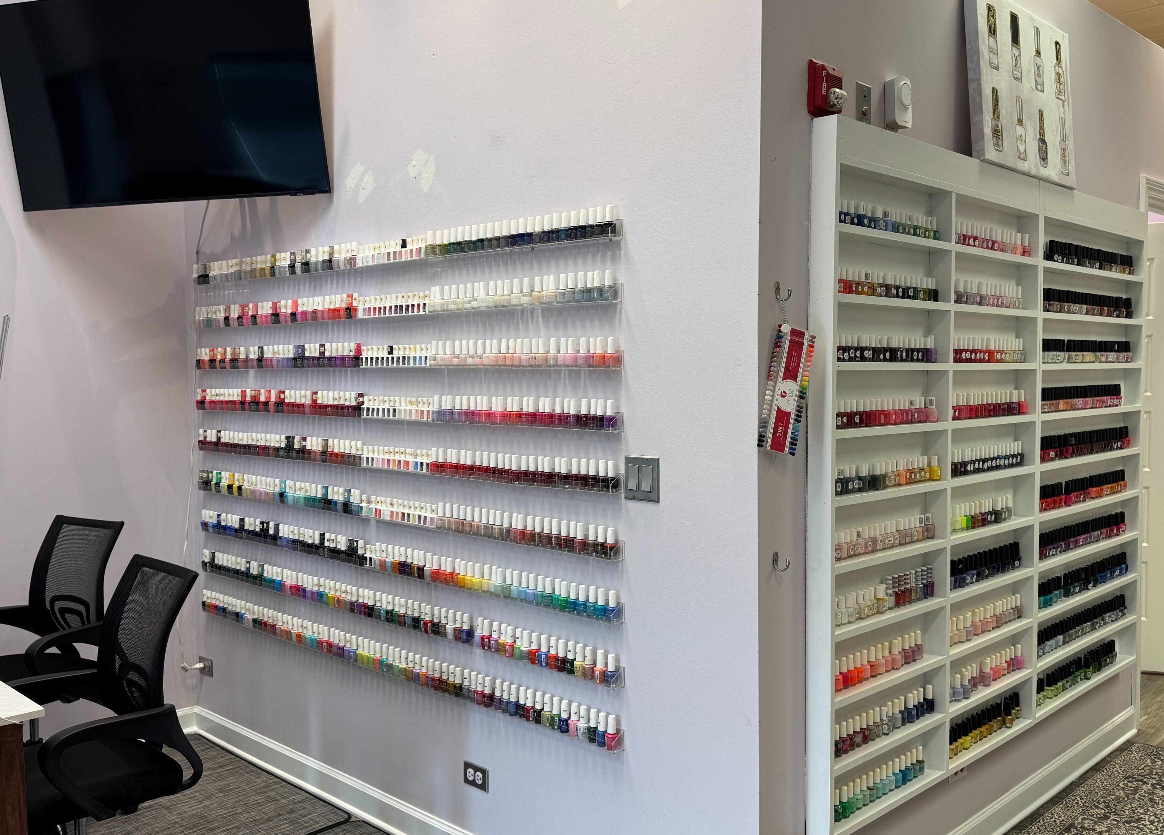 Nail polish wall at Misheel Nail Spa in Vernon Hills, Illinois, US showcasing vibrant colors.