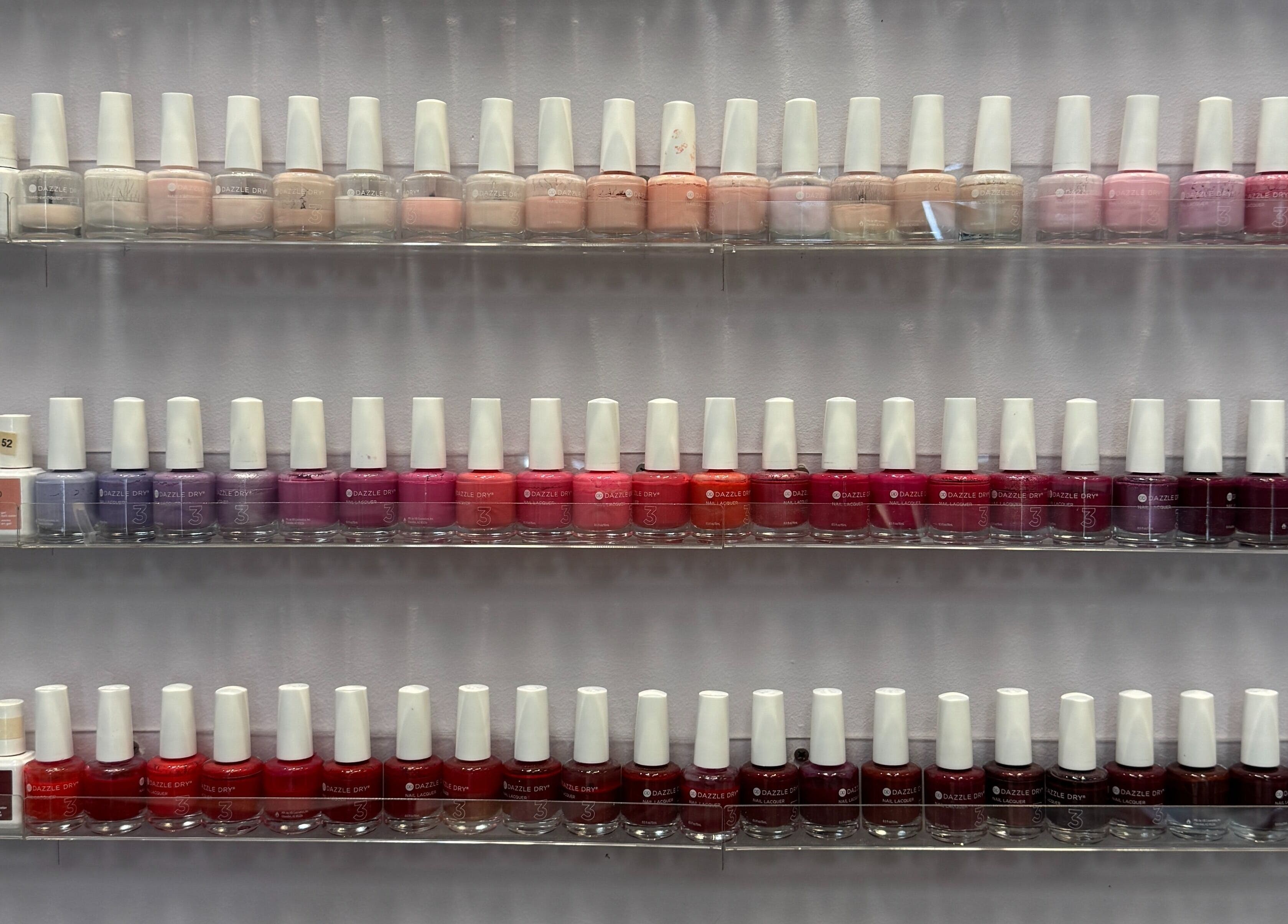 Nail polish collection at Misheel Nail Spa, Vernon Hills, Illinois, US, showcasing a vibrant color range.