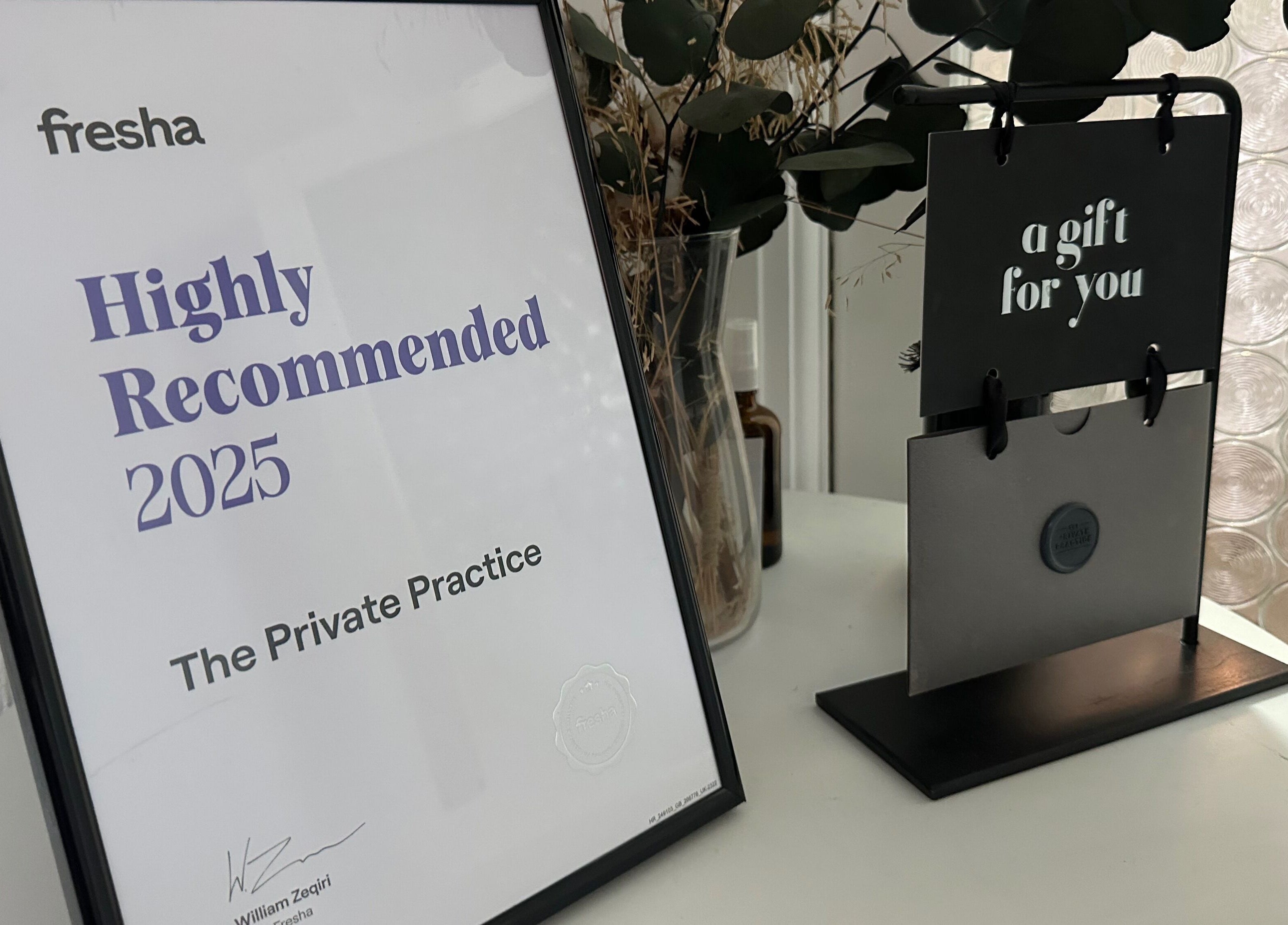 Award and gift display at The Private Practice, Birmingham, England, GB, highlighting top recognition.