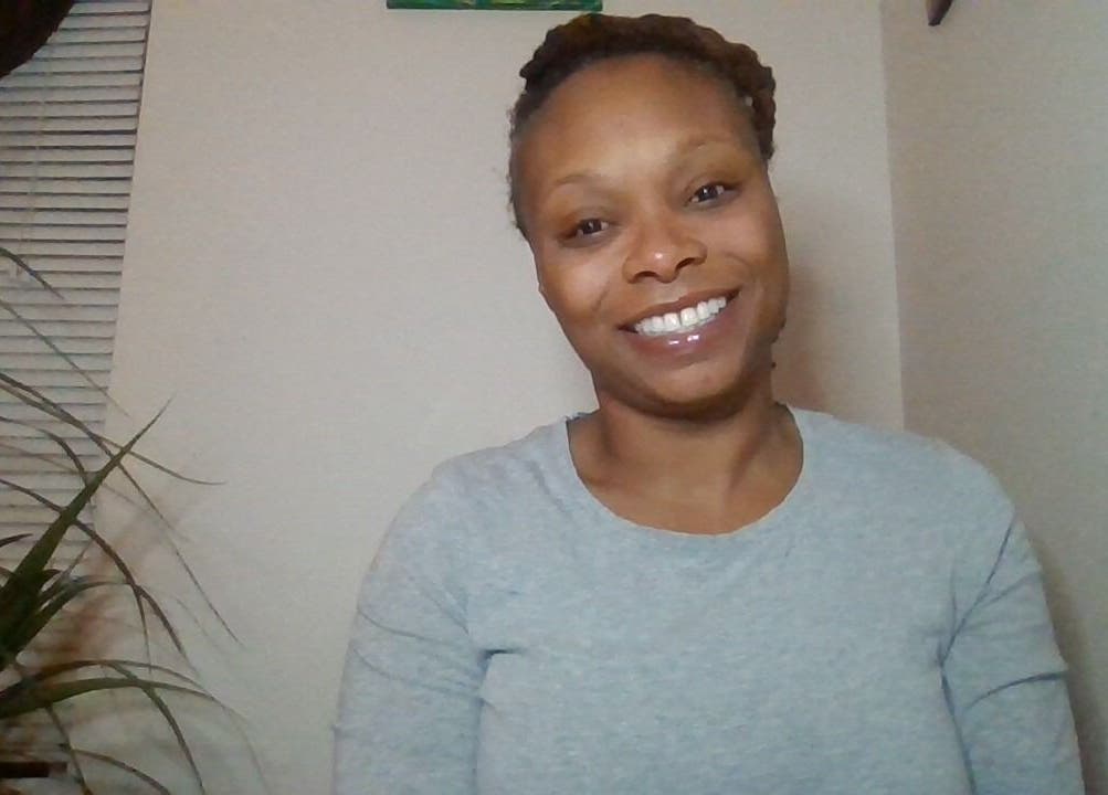 Friendly staff member at Mo'Living Massage & Studio LLC in Columbus, Ohio, US, enhancing visitor experience.