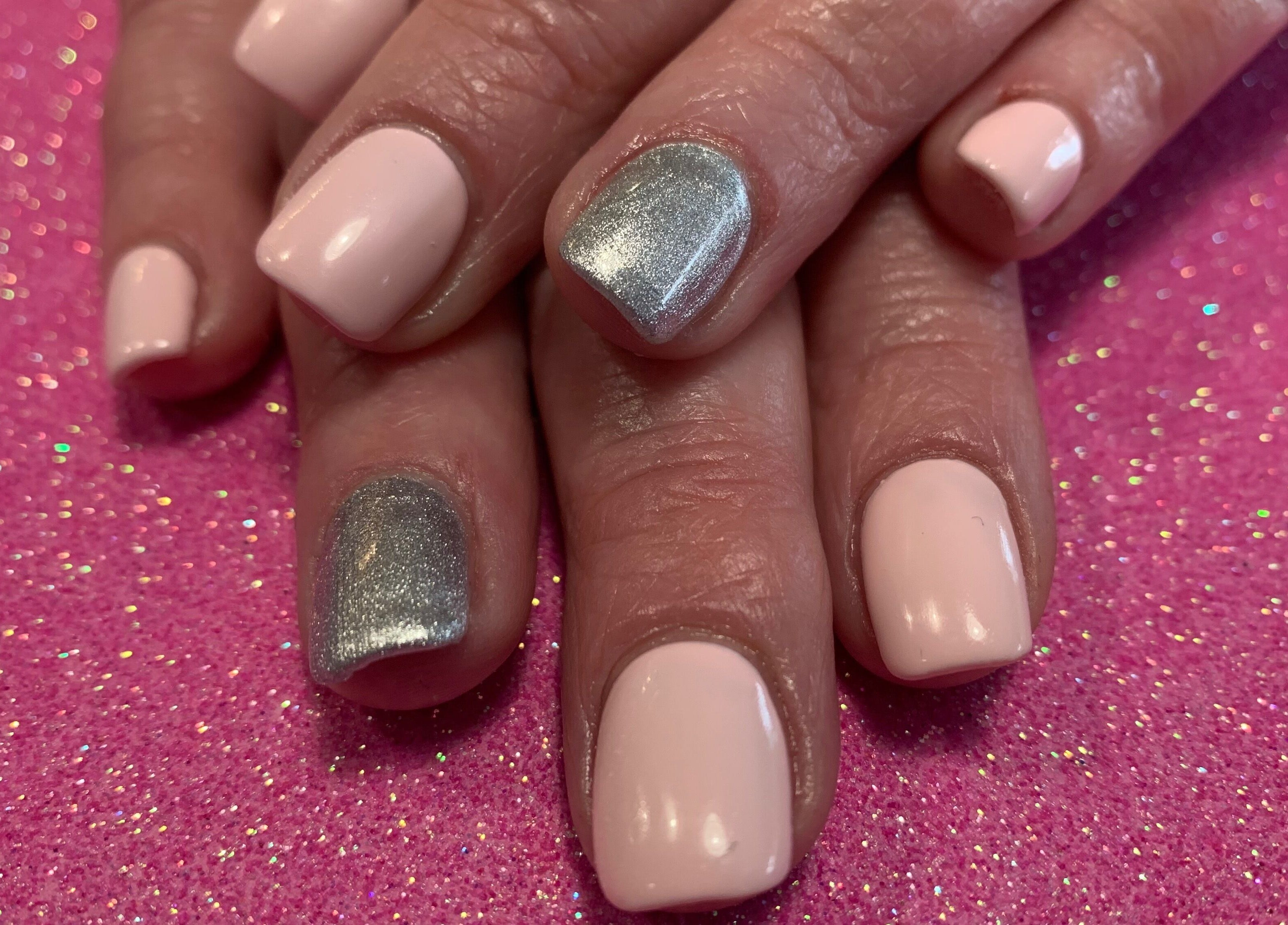 Stylish pink and silver nails at Simply Beautiful Nails & Beauty, North Shields, England, GB.