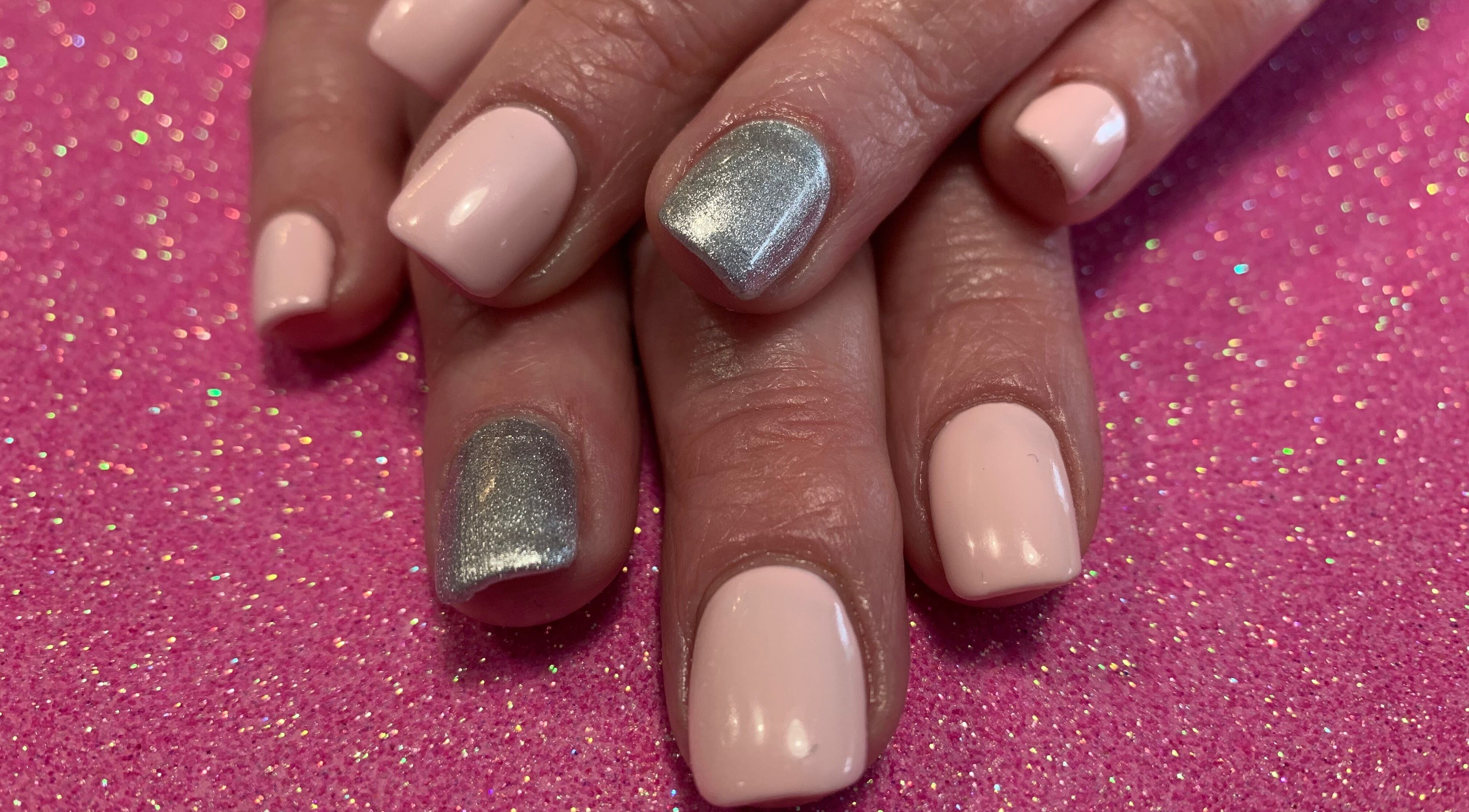 Stylish pink and silver nails at Simply Beautiful Nails & Beauty, North Shields, England, GB.