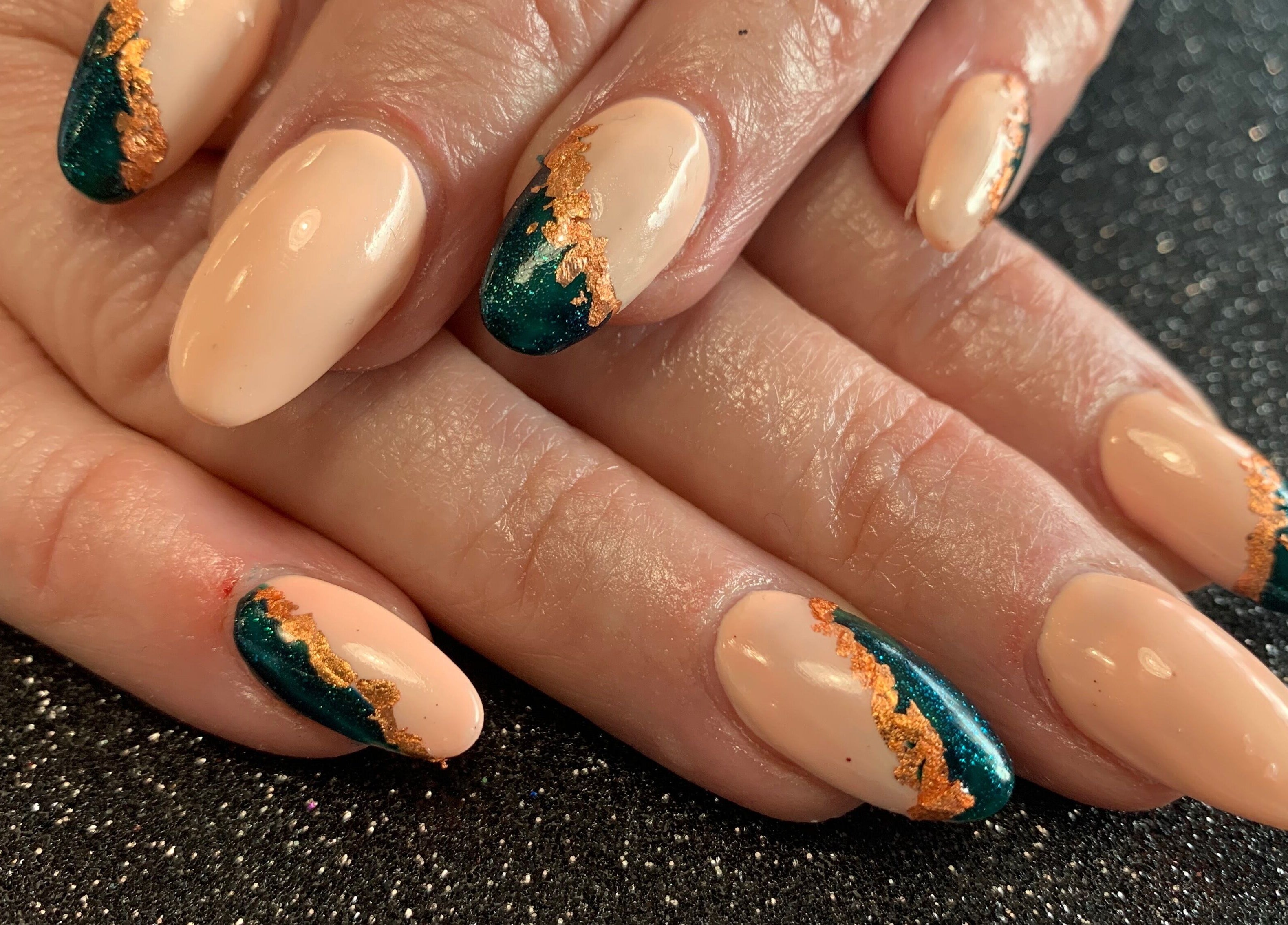 Elegant nail design at Simply Beautiful Nails & Beauty, North Shields, England, GB with green and gold accents.