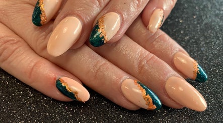 Elegant nail design at Simply Beautiful Nails & Beauty, North Shields, England, GB with green and gold accents.