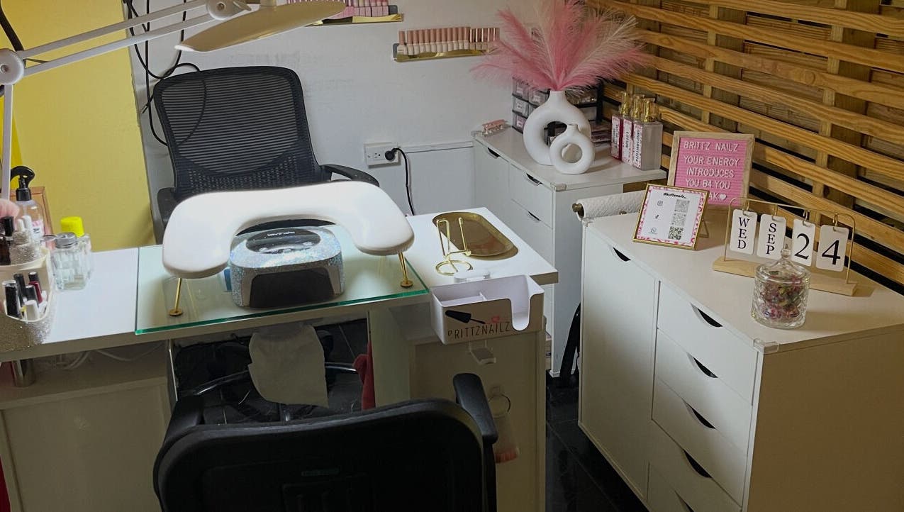 Modern nail station at Brittz Nailz, Mandeville, Manchester Parish, JM, showcasing elegant decor and tools.
