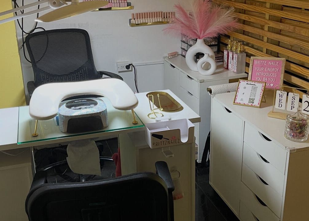 Modern nail station at Brittz Nailz, Mandeville, Manchester Parish, JM, showcasing elegant decor and tools.