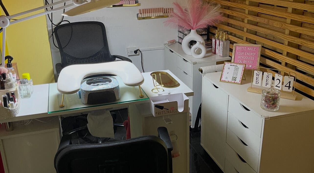 Modern nail station at Brittz Nailz, Mandeville, Manchester Parish, JM, showcasing elegant decor and tools.
