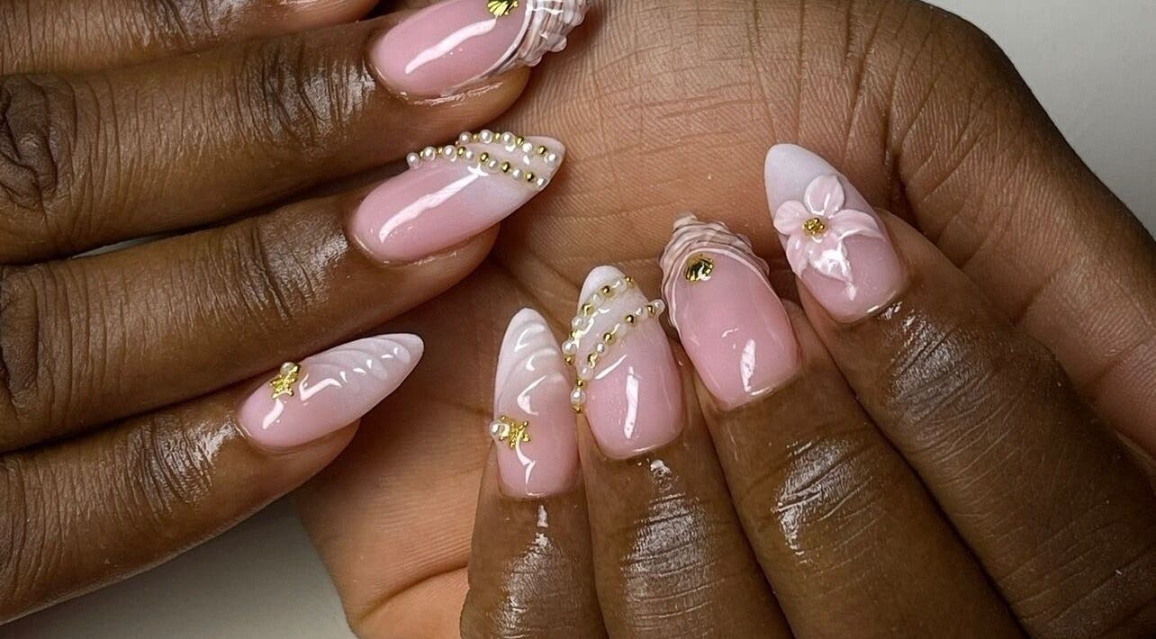 Intricate pink nail art with beads at Brittz Nailz, Mandeville, Manchester Parish, JM.