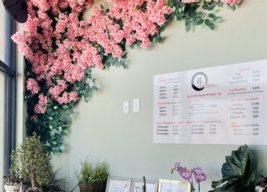 Elegant floral decor and service menu at Su Microblading & Wellness Massage, Parker, Colorado, US.
