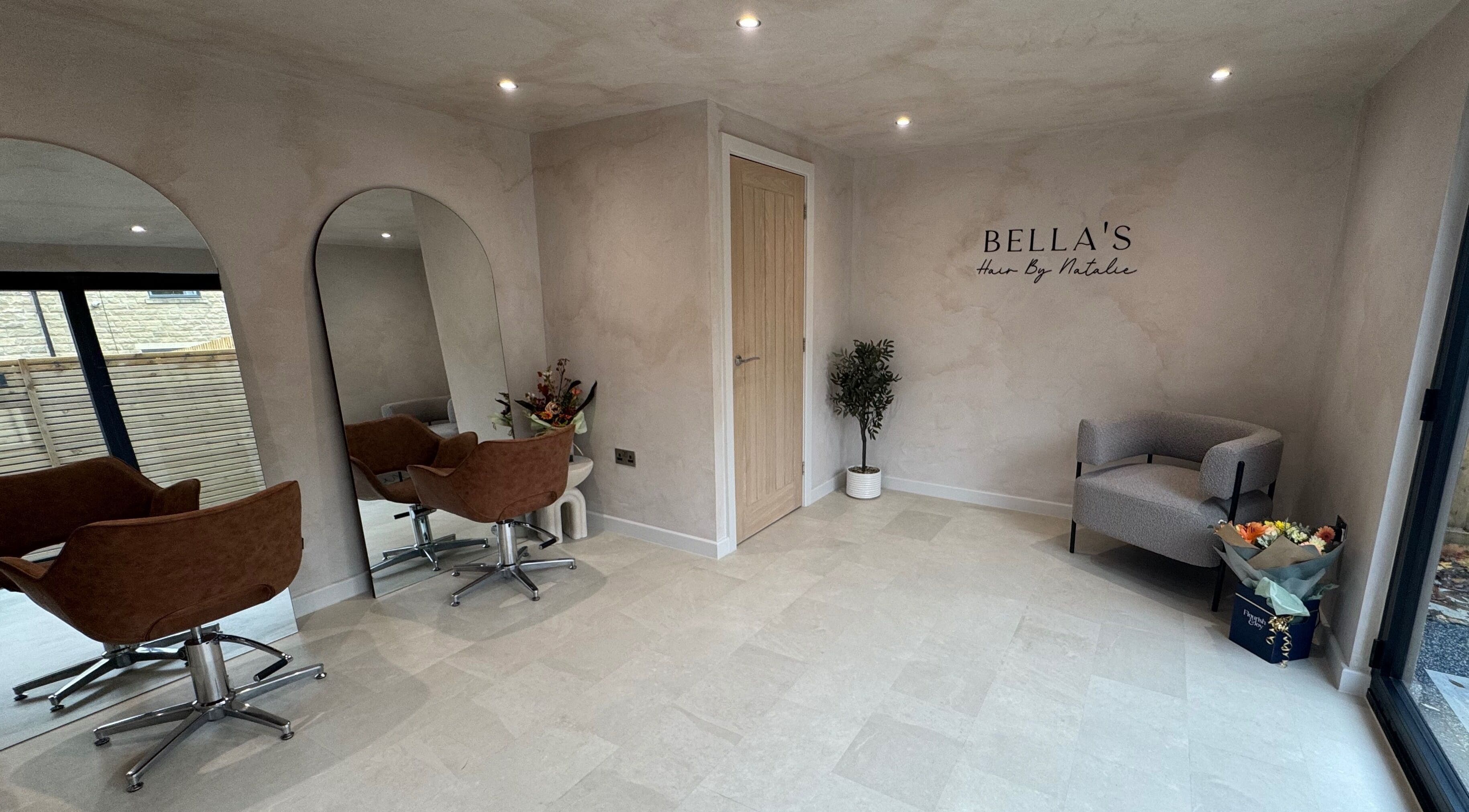 Modern salon with mirrors and chairs at Bella's - hair by Natalie in Barnoldswick, England, GB.