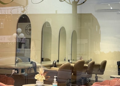 Chic interiors of Zen Hair Co with styling chairs and decor at Auckland, Auckland, NZ.