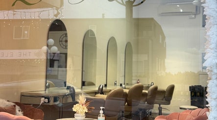 Chic interiors of Zen Hair Co with styling chairs and decor at Auckland, Auckland, NZ.