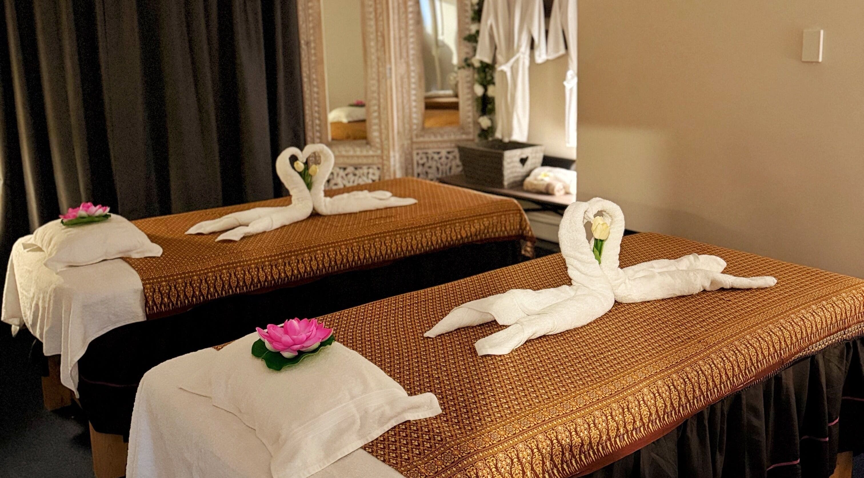 Peaceful massage room at Homm Thai Massage, Auckland, NZ with elegant decor and fresh linens.