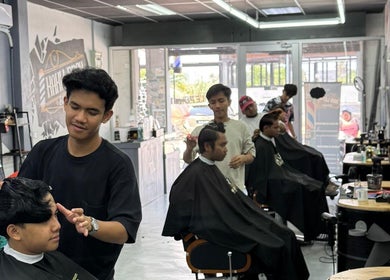 Stylists at work in Alep KLB barber shop, Bandar Baru Bangi, Selangor, MY, providing professional haircuts.