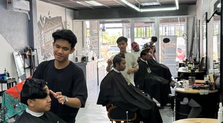 Stylists at work in Alep KLB barber shop, Bandar Baru Bangi, Selangor, MY, providing professional haircuts.