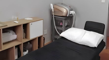 Treatment room at Prim Nails Skin Hair in Pretoria, Gauteng, ZA featuring a spa bed and equipment.