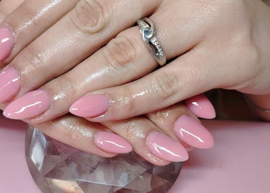 Stylish pink manicured nails at Prim Nails Skin Hair, Pretoria, Gauteng, ZA, showcasing quality nail art.