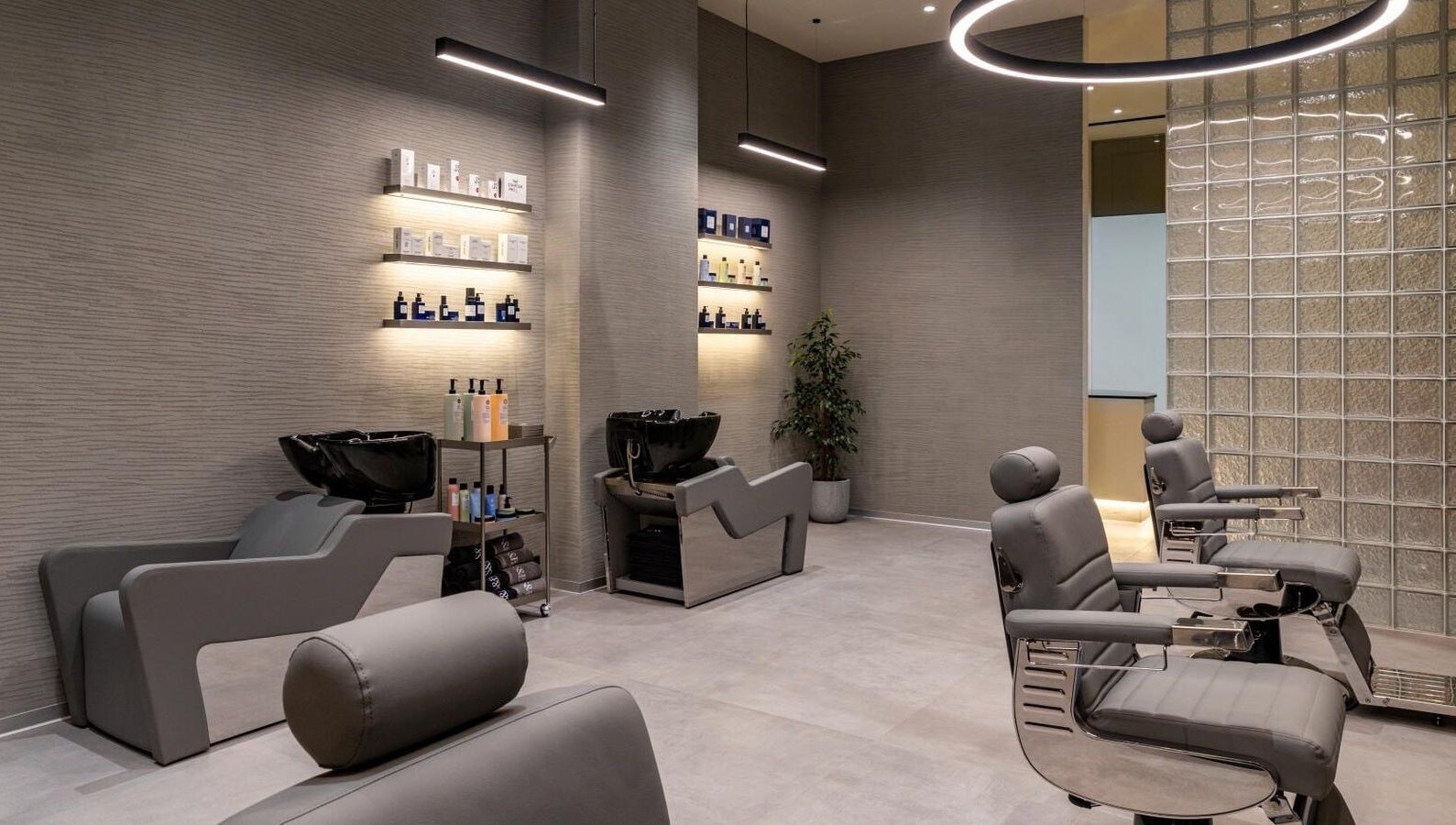 Luxurious interior of S&B Grooming in دبي, دبي, AE featuring modern salon chairs and sleek decor.
