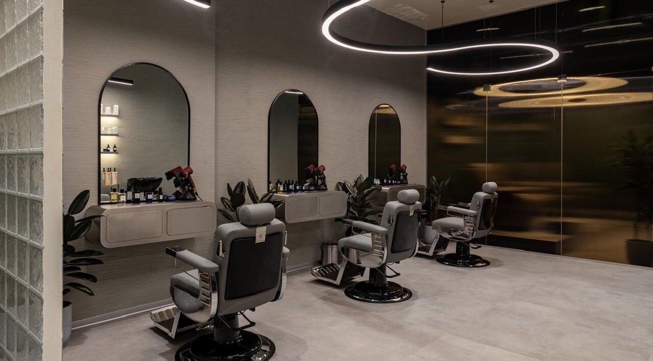 Modern barber chairs and mirrors at S&B Grooming, دبي, دبي, AE reflecting stylish design.