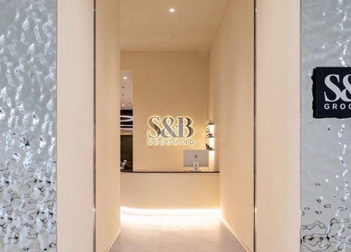 S&B Grooming's chic entrance with illuminated logo at دبي, دبي, AE, showcasing luxury and style.