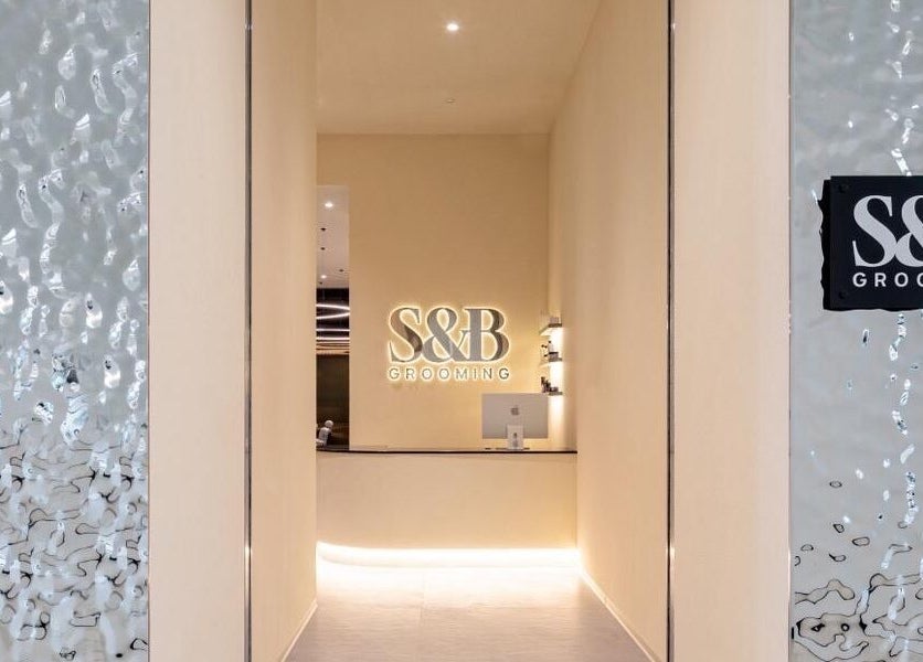 S&B Grooming's chic entrance with illuminated logo at دبي, دبي, AE, showcasing luxury and style.