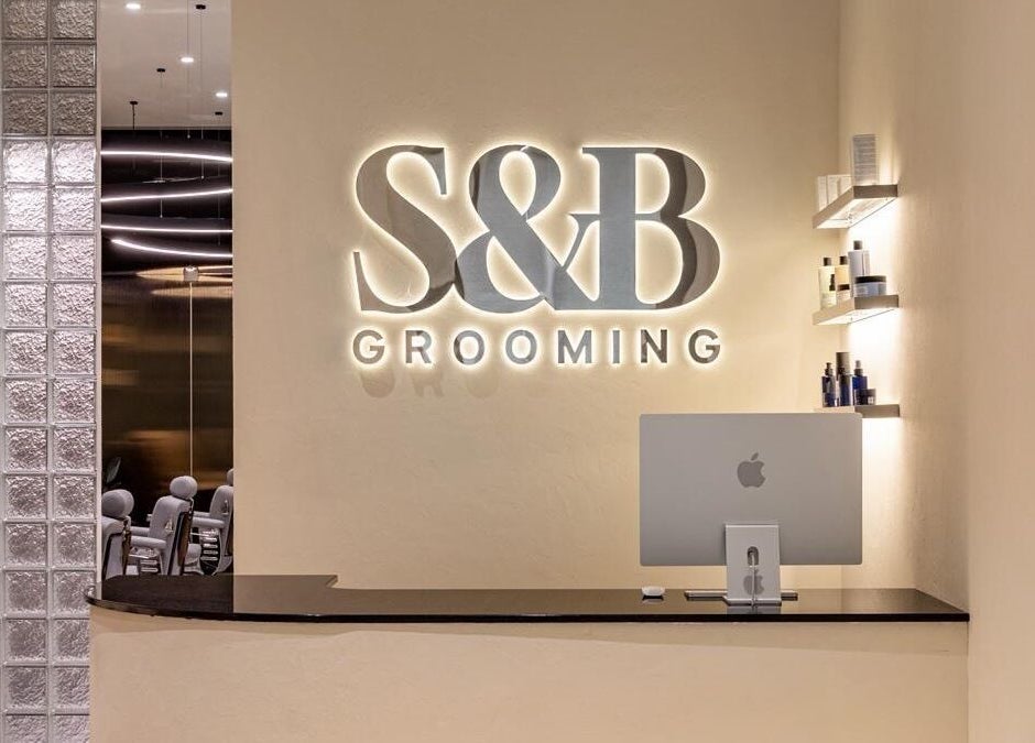 Elegant S&B Grooming reception area in دبي, دبي, AE, showcasing modern design and ambient lighting.
