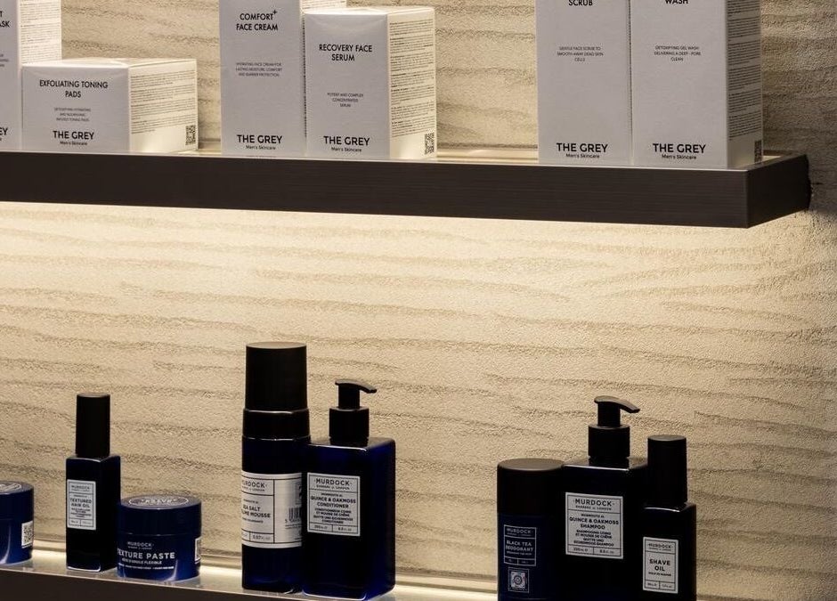 Elegant grooming products on a shelf at S&B Grooming, دبي, دبي, AE, showcasing premium skincare items.