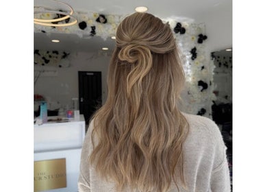 Styled wavy hair at Shelbi Halewood Hair, Prestwich, England, GB, showcasing expert hairstyling.