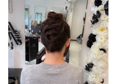 Elegant updo hairstyle at Shelbi Halewood Hair in Prestwich, England, GB, showcasing expert styling.