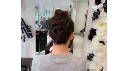 Elegant updo hairstyle at Shelbi Halewood Hair in Prestwich, England, GB, showcasing expert styling.