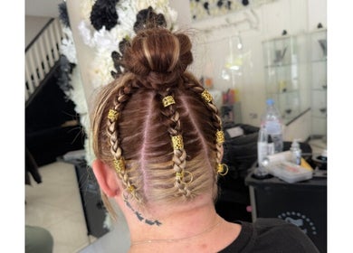 Intricate braided hairstyle with gold accents created at Shelbi Halewood Hair in Prestwich, England, GB.
