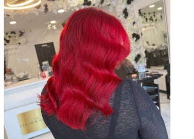 Red hair styled in waves at Shelbi Halewood Hair, Prestwich, England, GB.