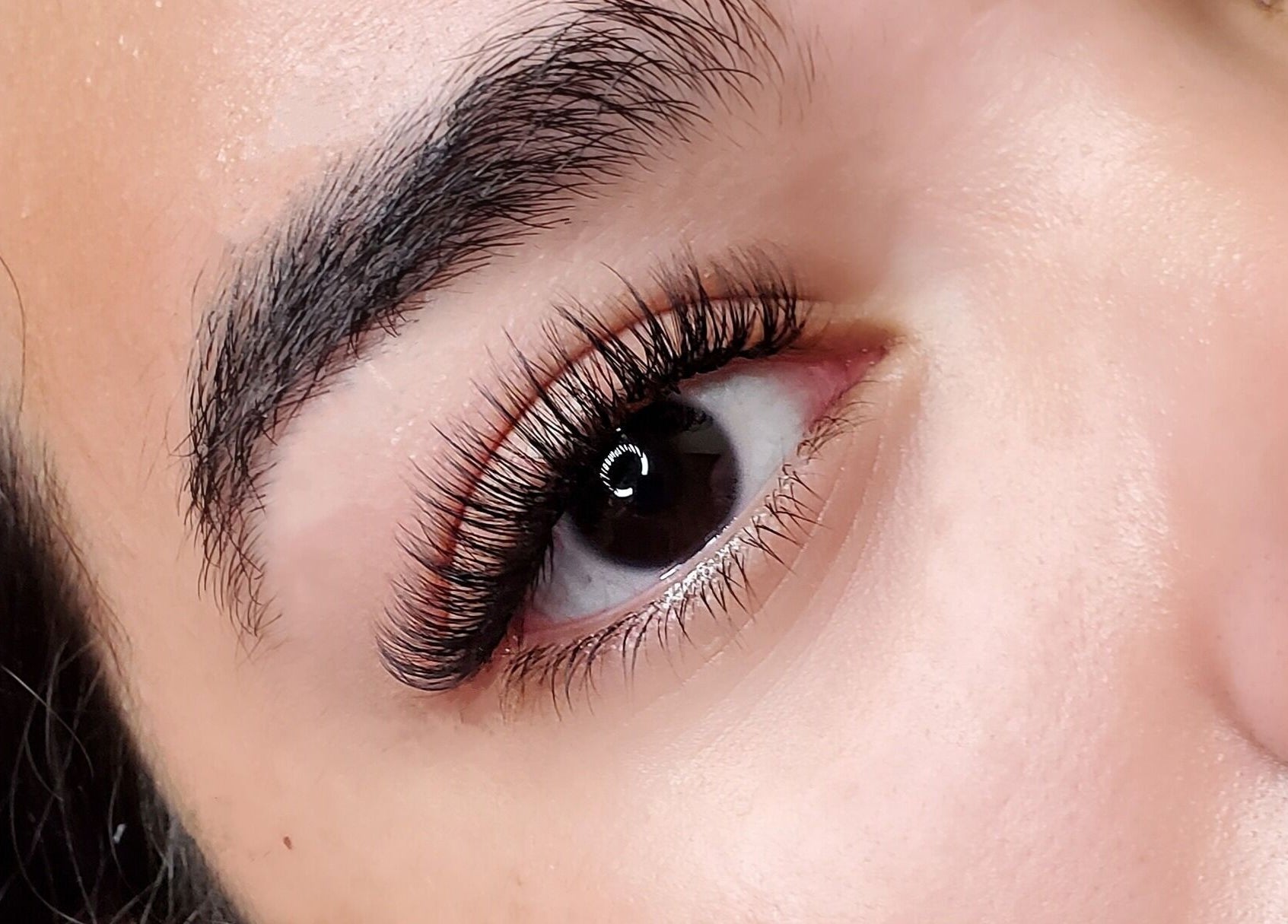 Close-up of lush eyelashes at London Aesthetics, London, Ontario, CA for beauty enhancement.