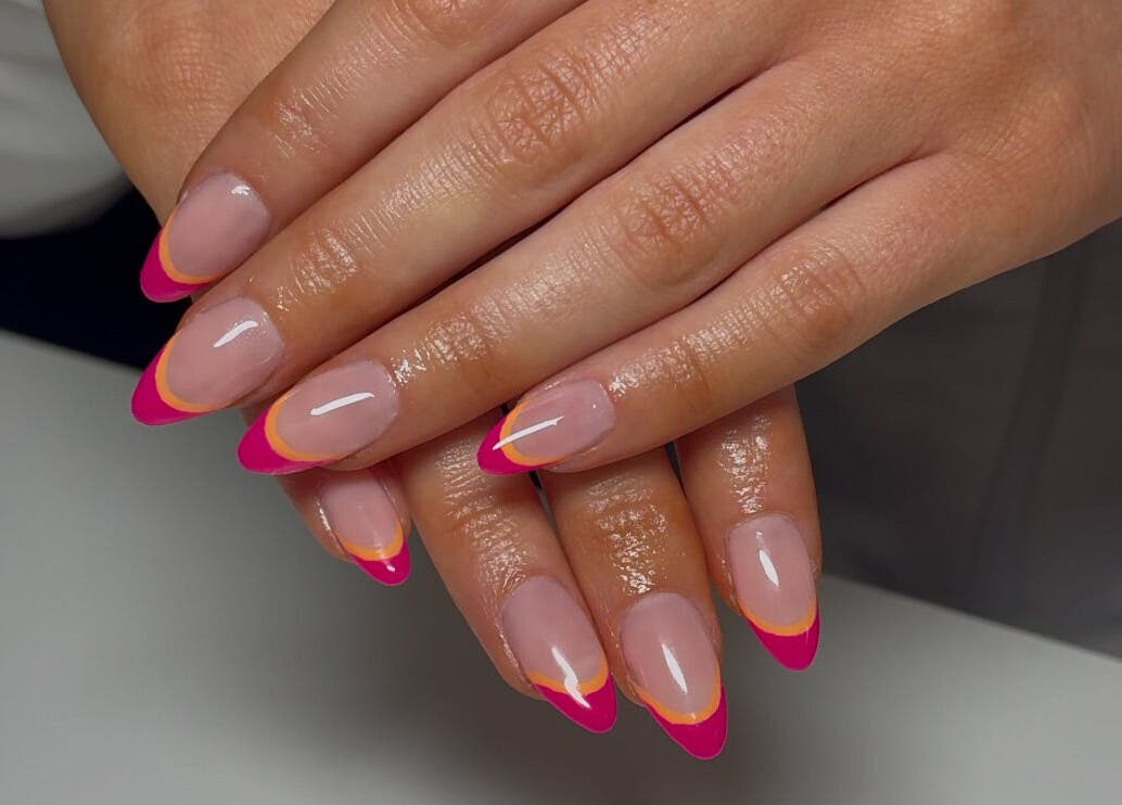Stylishly manicured nails with bright tips at London Aesthetics, London, Ontario, CA.