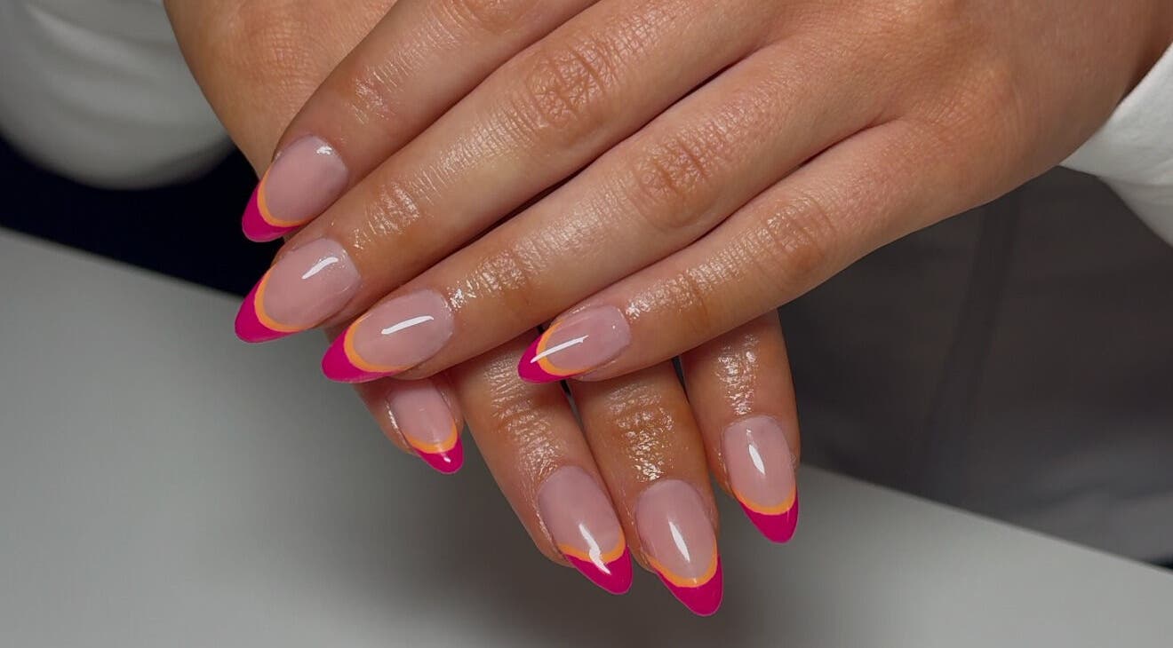 Stylishly manicured nails with bright tips at London Aesthetics, London, Ontario, CA.