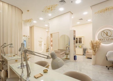 Interior of Next Level Women Salon in Dubai, AE with modern decor and beauty stations.
