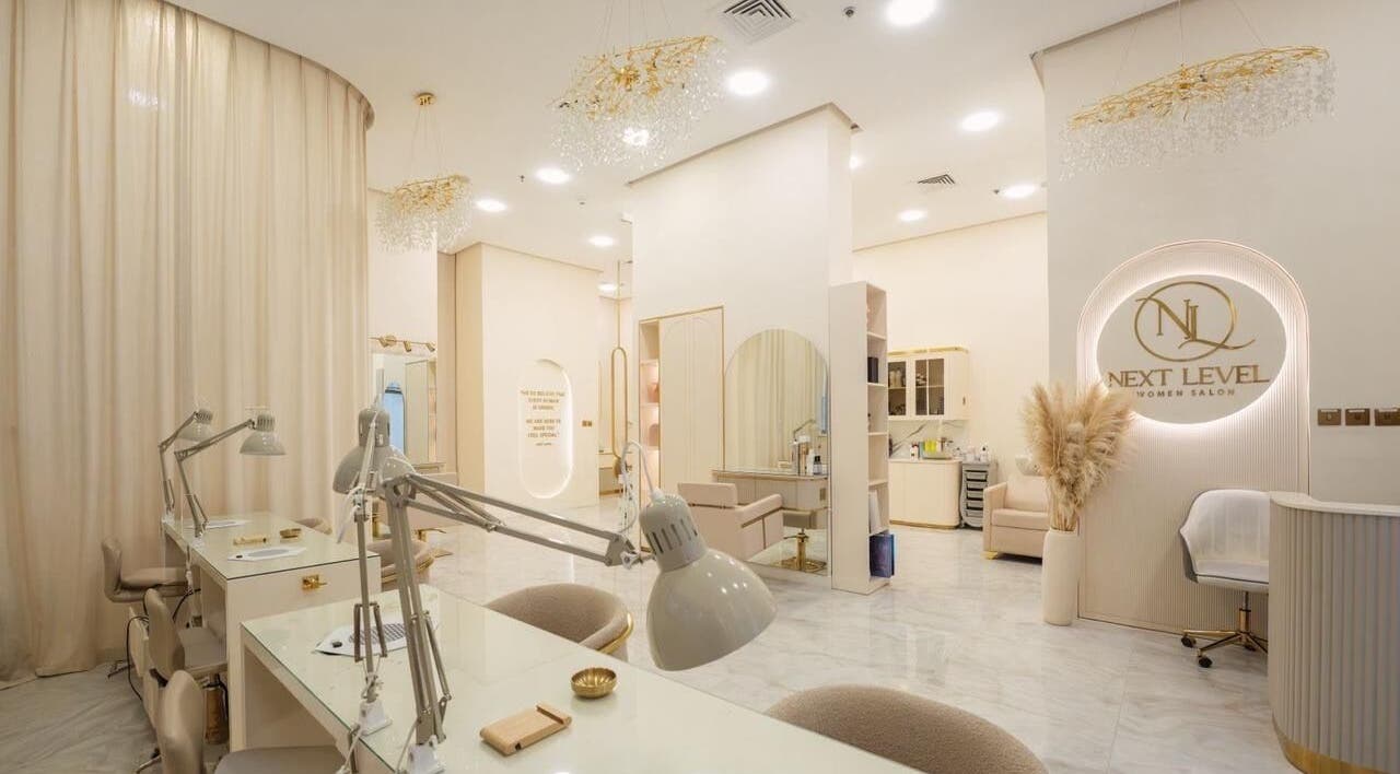 Chic interior of Next Level Women Salon in Dubai, Dubai, AE showcasing modern styling stations and decor.