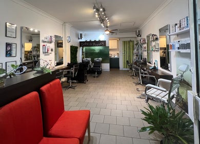Elegant interior of Zeba Hair Studio, Rose Bay, New South Wales, AU. Stylish seating and sleek decor.