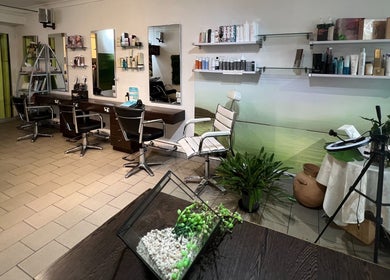 Interior of Zeba Hair Studio, Rose Bay, New South Wales, AU, featuring stylish chairs and hair products.