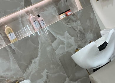 Luxury hair wash station at EMMLOU BEAUTY, Cheadle Hulme, England, GB with sleek design and products.