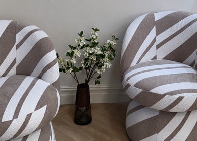 Stylish chairs and flowers at EMMLOU BEAUTY, Cheadle Hulme, England, GB enhancing tranquility.